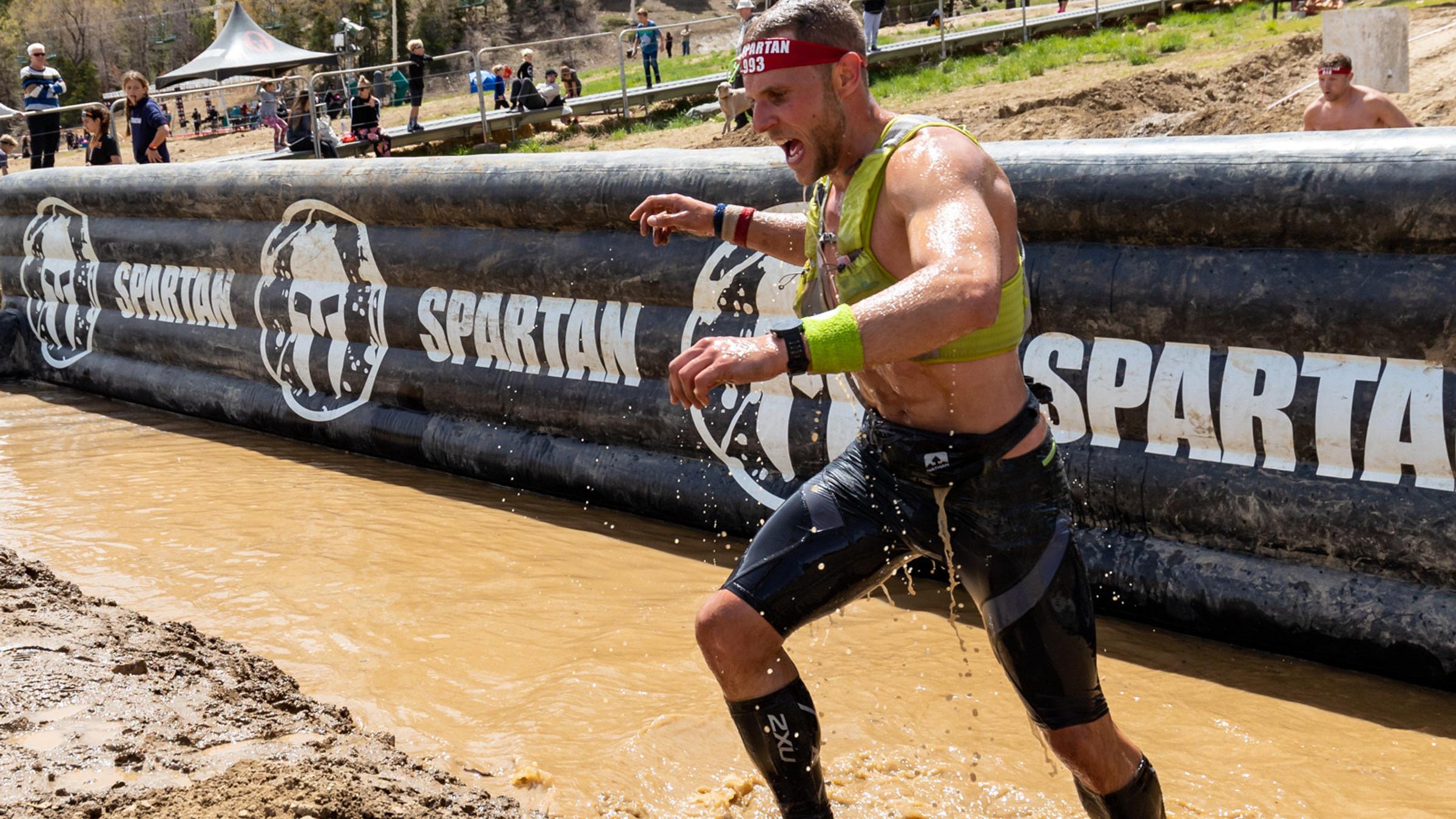 Spartan runner in mud