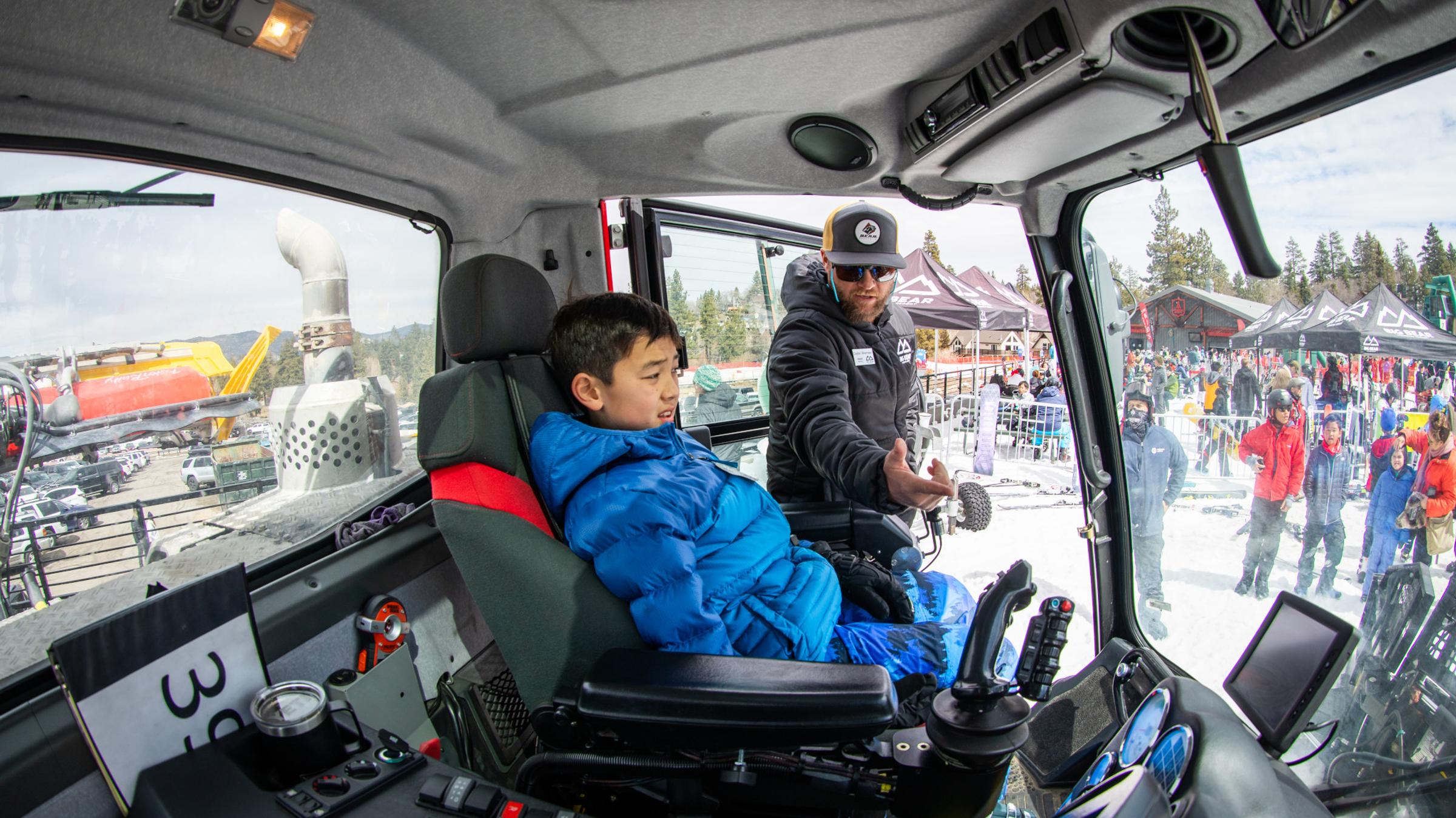 showing a scout the inside of a snow cat