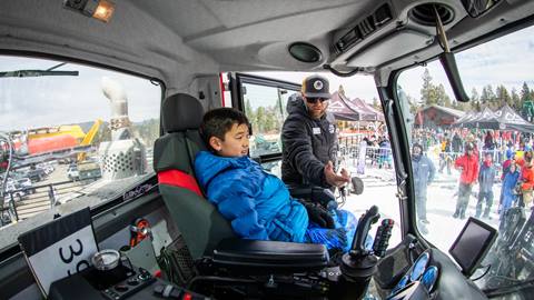 showing a scout the inside of a snow cat