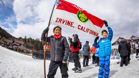 Scouts holding up their flag