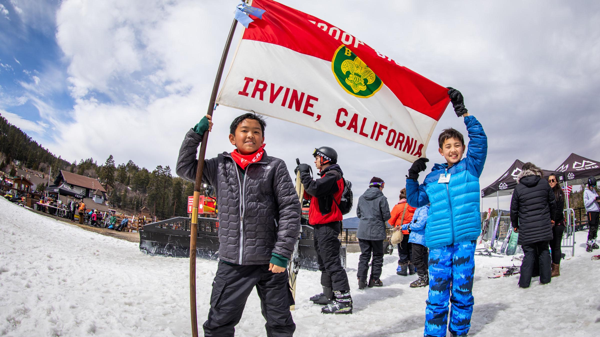 Scouts holding up their flag