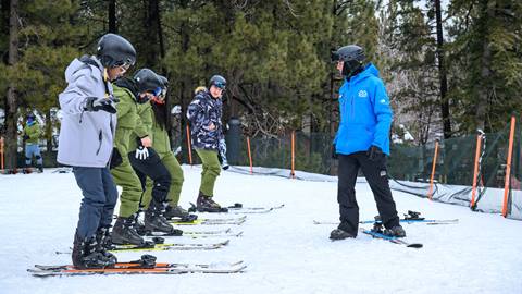 Ski instructor with five guest on skis