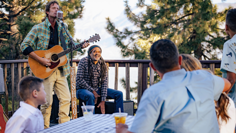 Family watching a band during Skyline at Sundown at Snow Summit in the summer