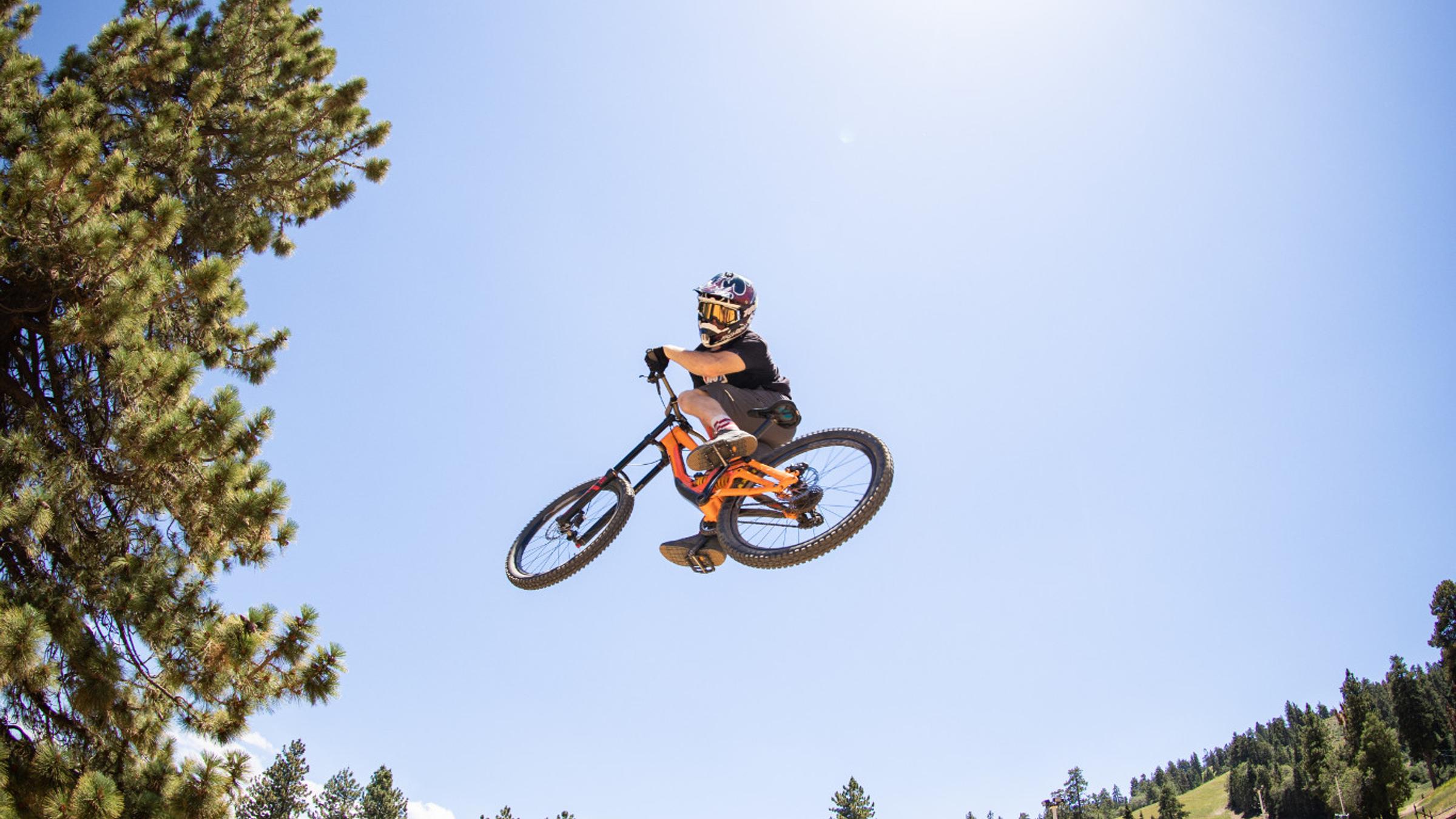 Mountain biker doing a trick in the air