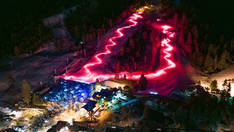 Snow Summit's New Year's Eve Concert and Torchlight Parade drone shot of the hill lit up