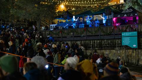 Snow Summit's New Year's Eve Concert and Torchlight Parade crowd watching live band, Twin Fin.