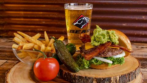 Clubhouse Grill menu items including fries, a bacon cheeseburger, and frothy beverage in a Bear Mountain glass.