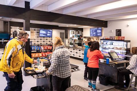 Guests checking out at a food court style venue