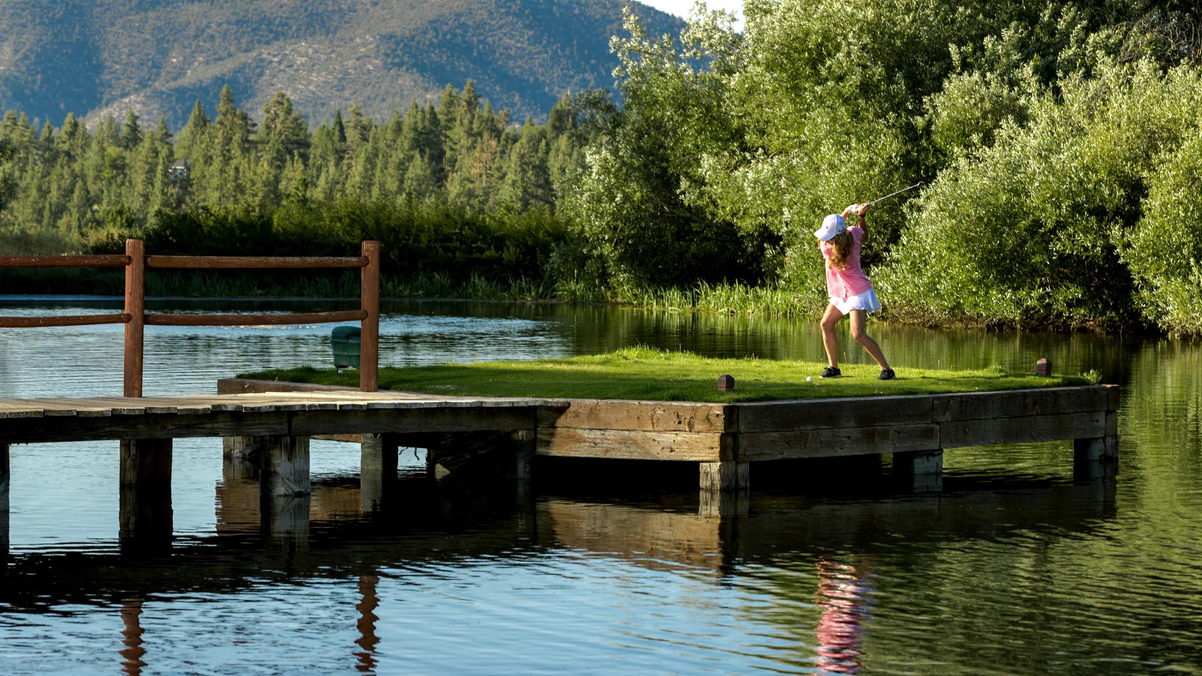 Woman golfing