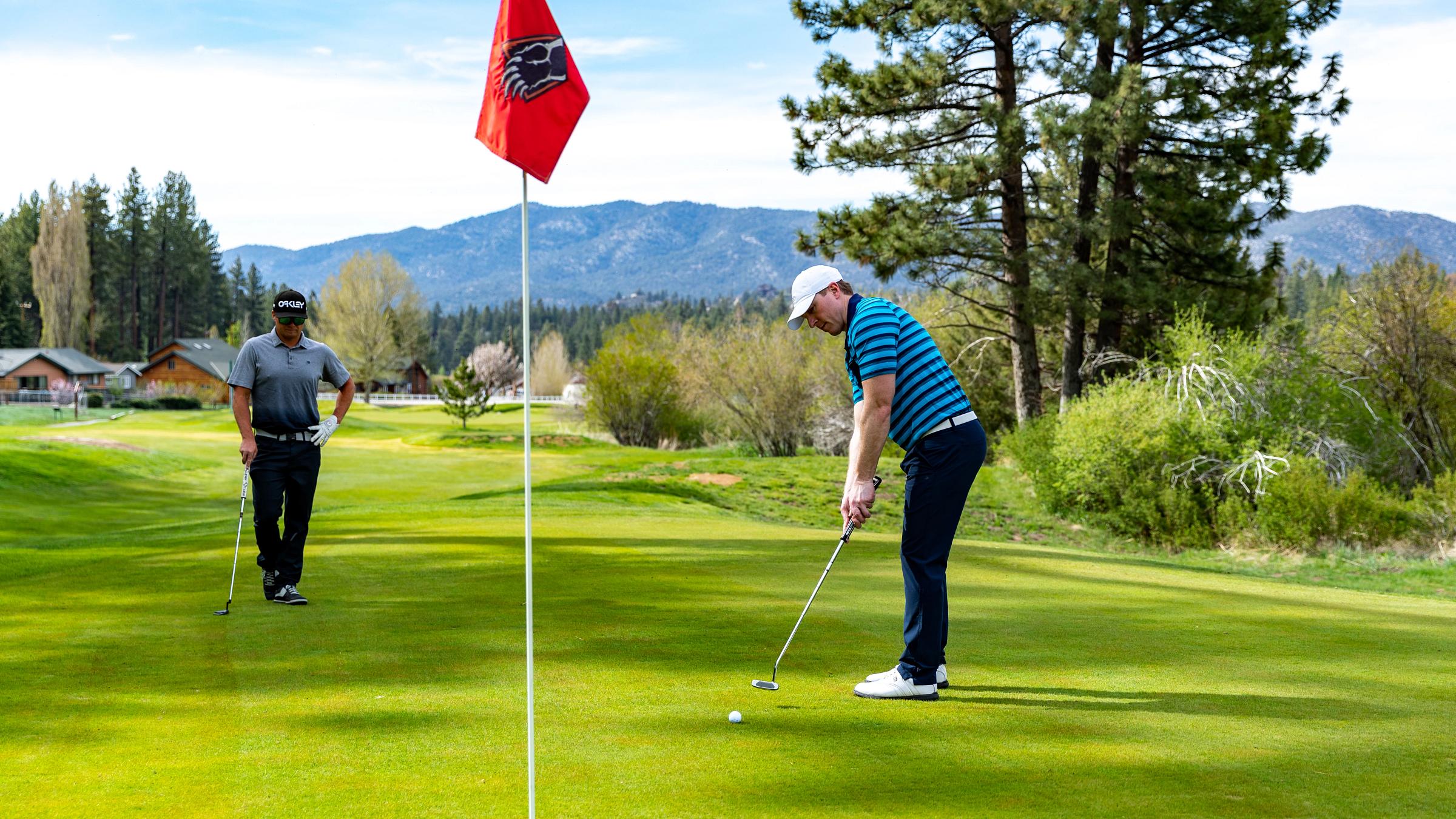 Two men golfing