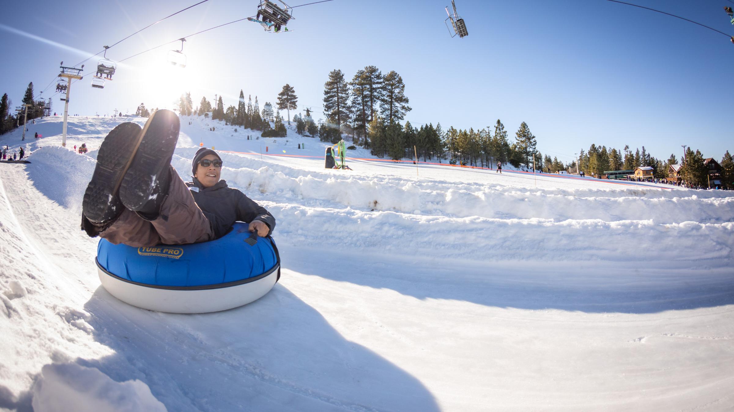 Man riding the tube park