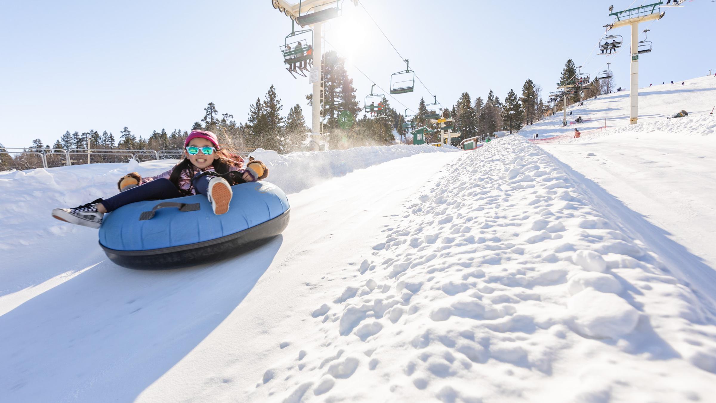 Child riding the tube park 