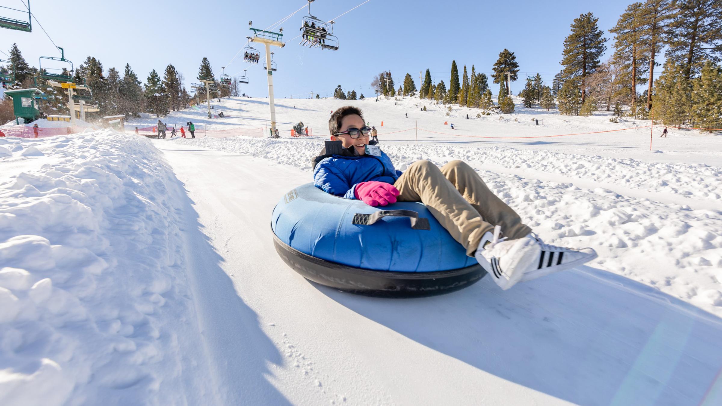 Man on a snow tube