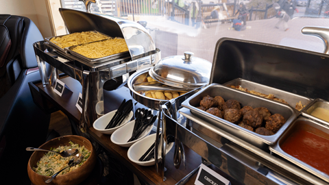 catered food displayed on a table in the Ikon Pass Suite at Snow Summit