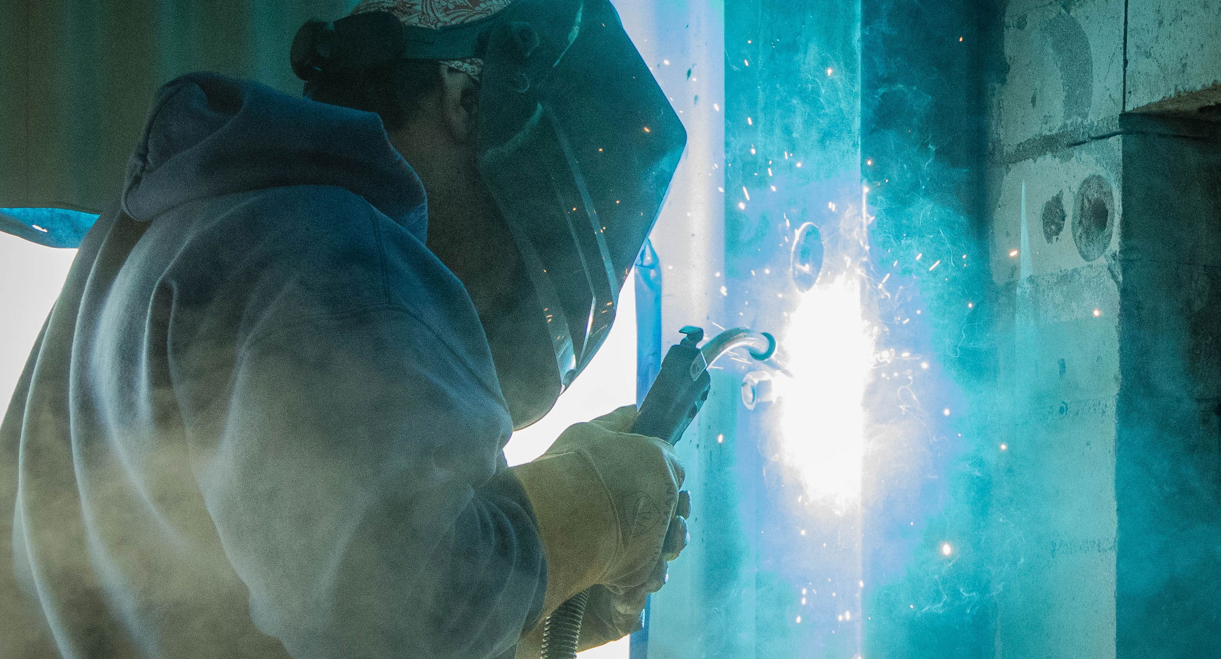 Construction worker working indoors with fire