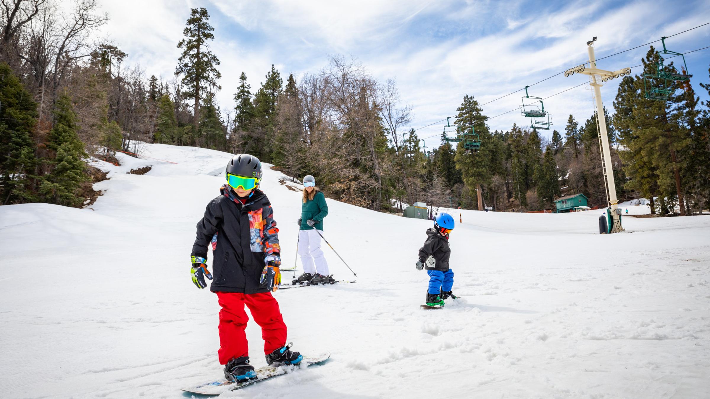 kids skiing and snowboarding