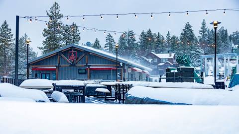 Adventure Academy with new snowfall on tables and chairs