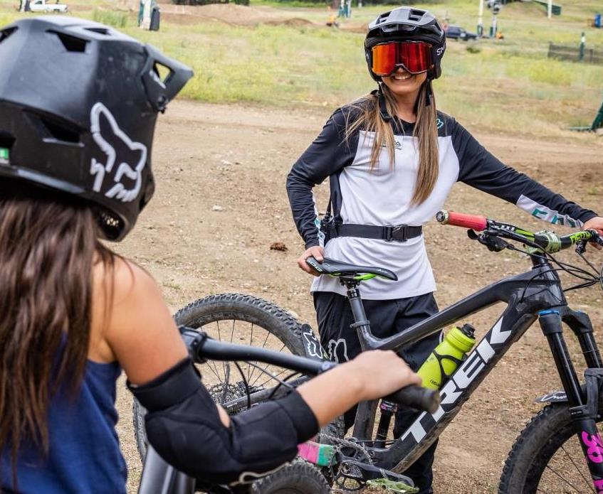 Mountain bike instructor with child students