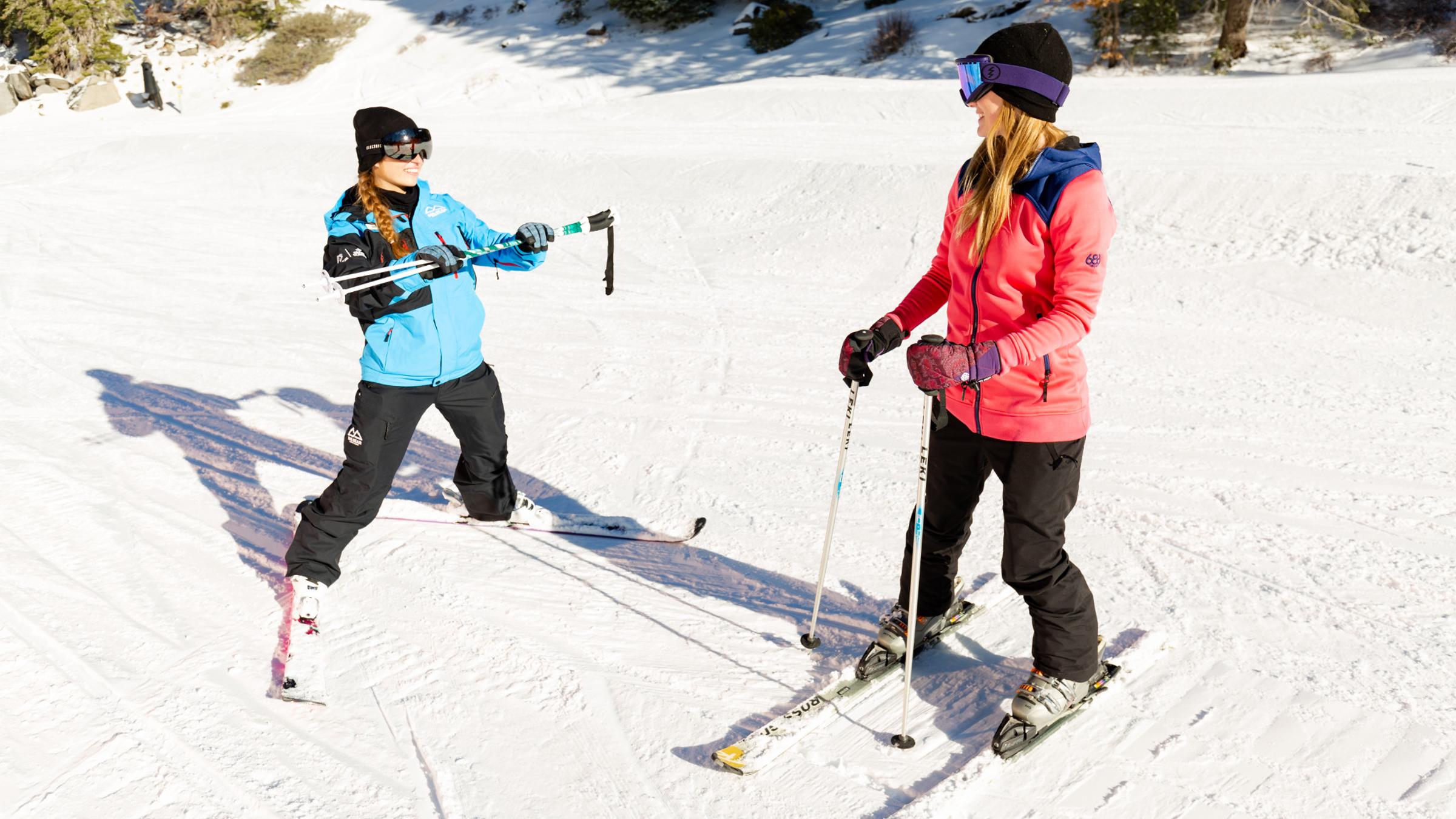 Ski instructor with student.