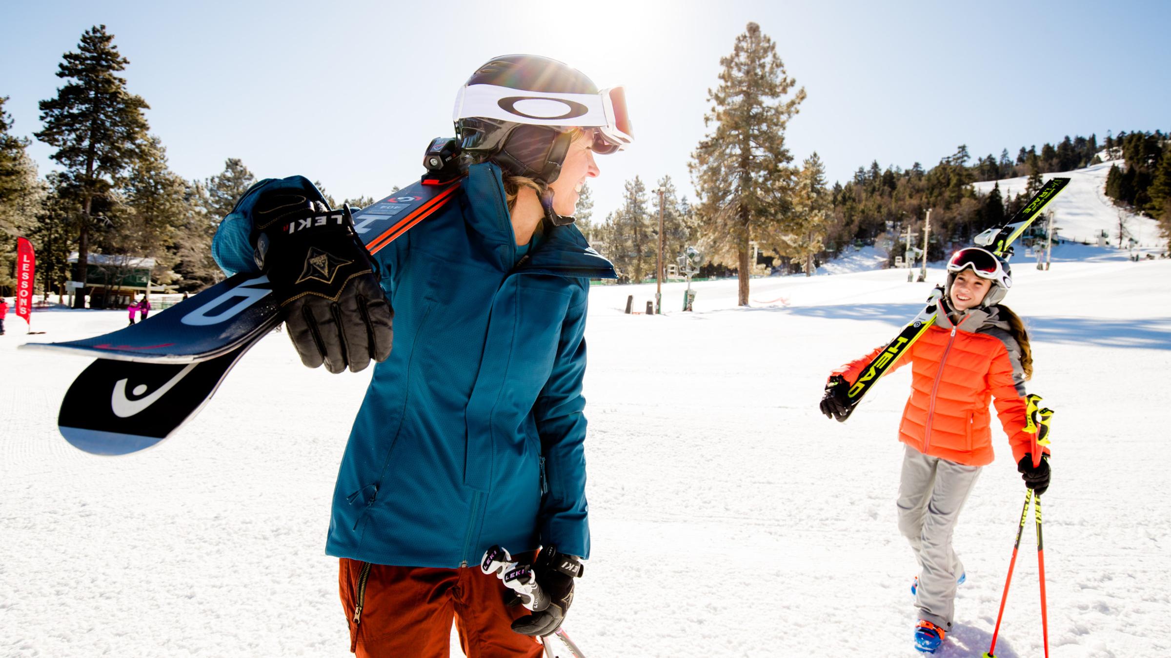 Two skiers walking in snow