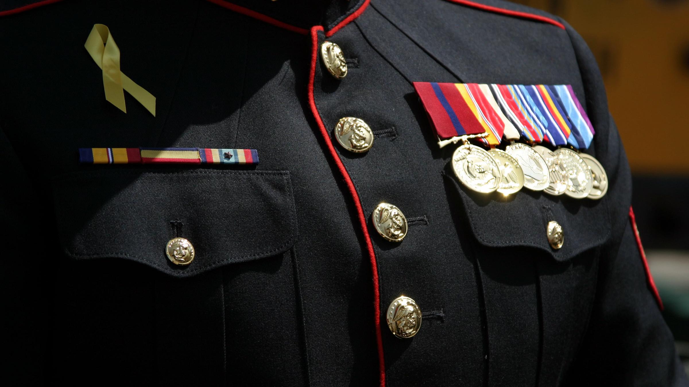 Close up of a military uniform with awards.