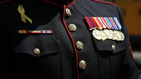 Close up of a military uniform with awards.