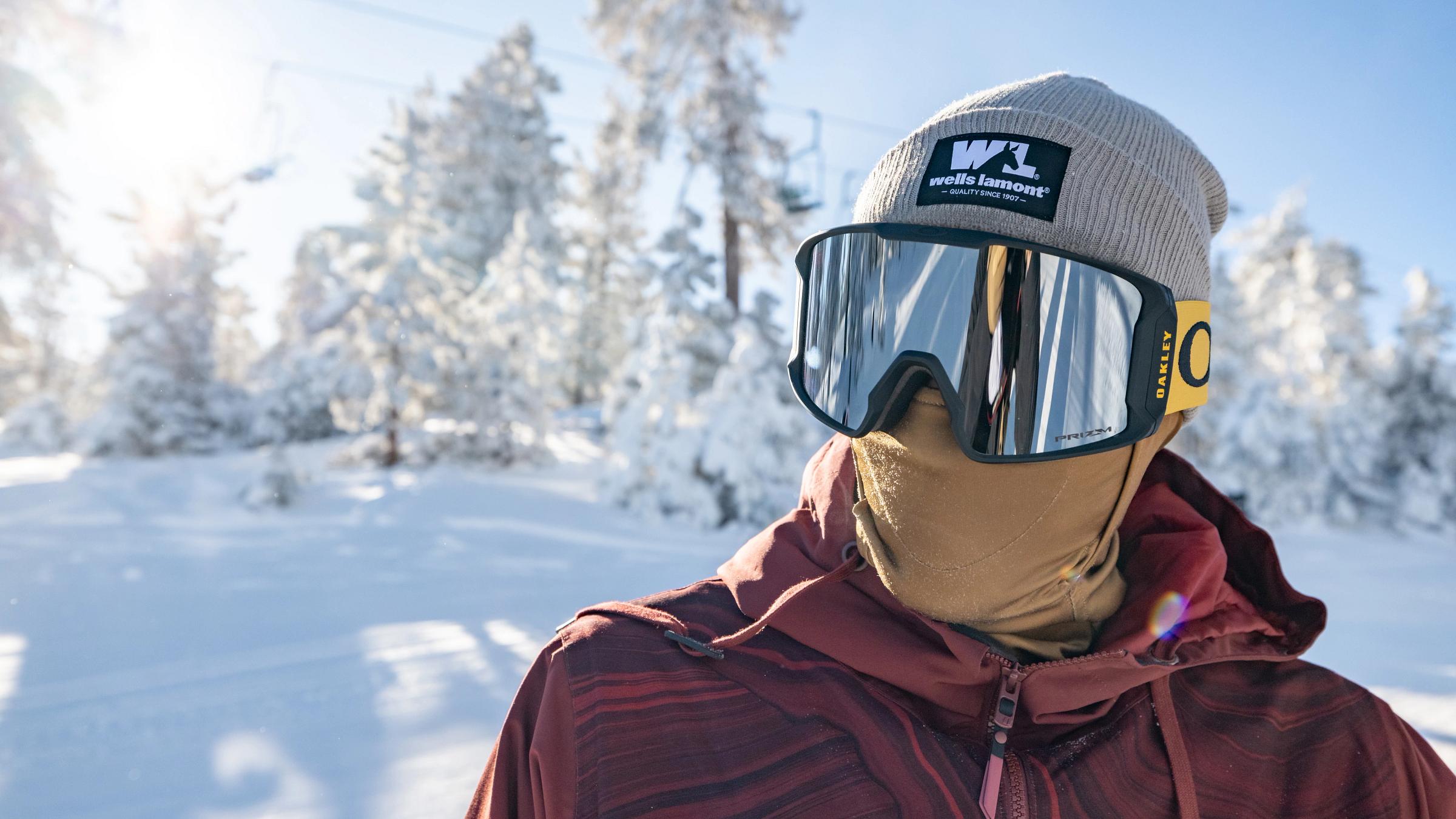 Snowboarder close up in snow goggles