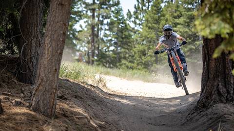Close up of a bike rider on an ebike rental at Snow Summit Bike Park.