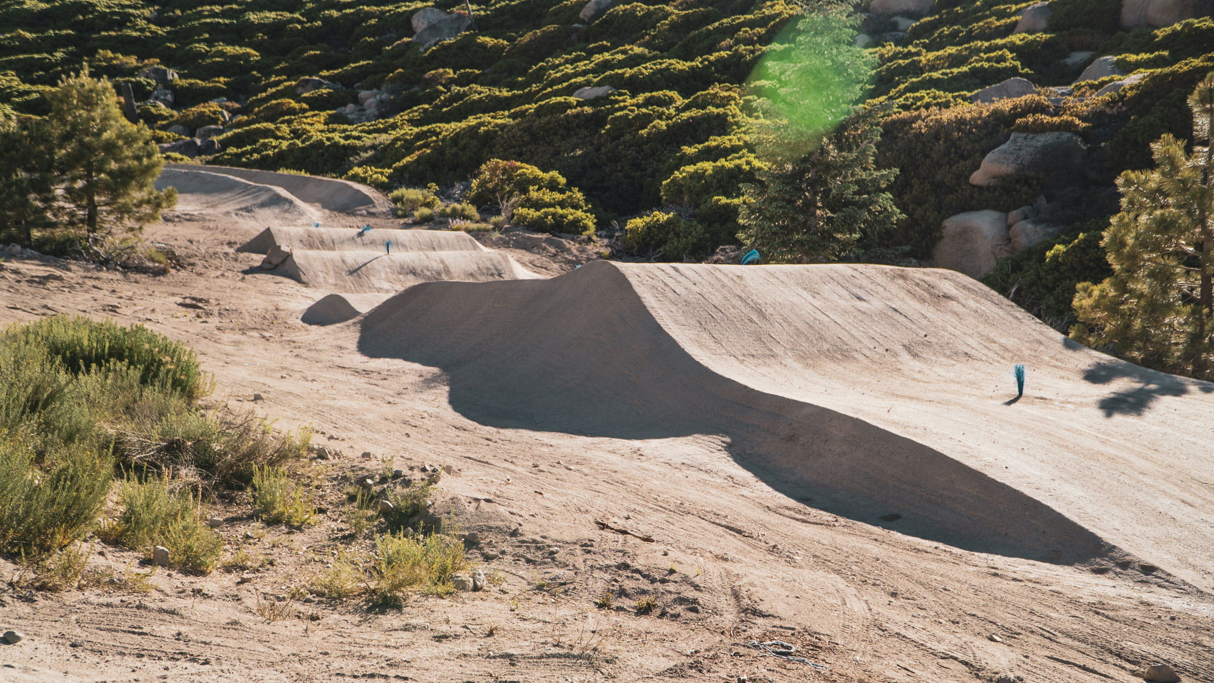 Dirt wave run on a mountain bike trail in the summertime at Snow Valley bike park