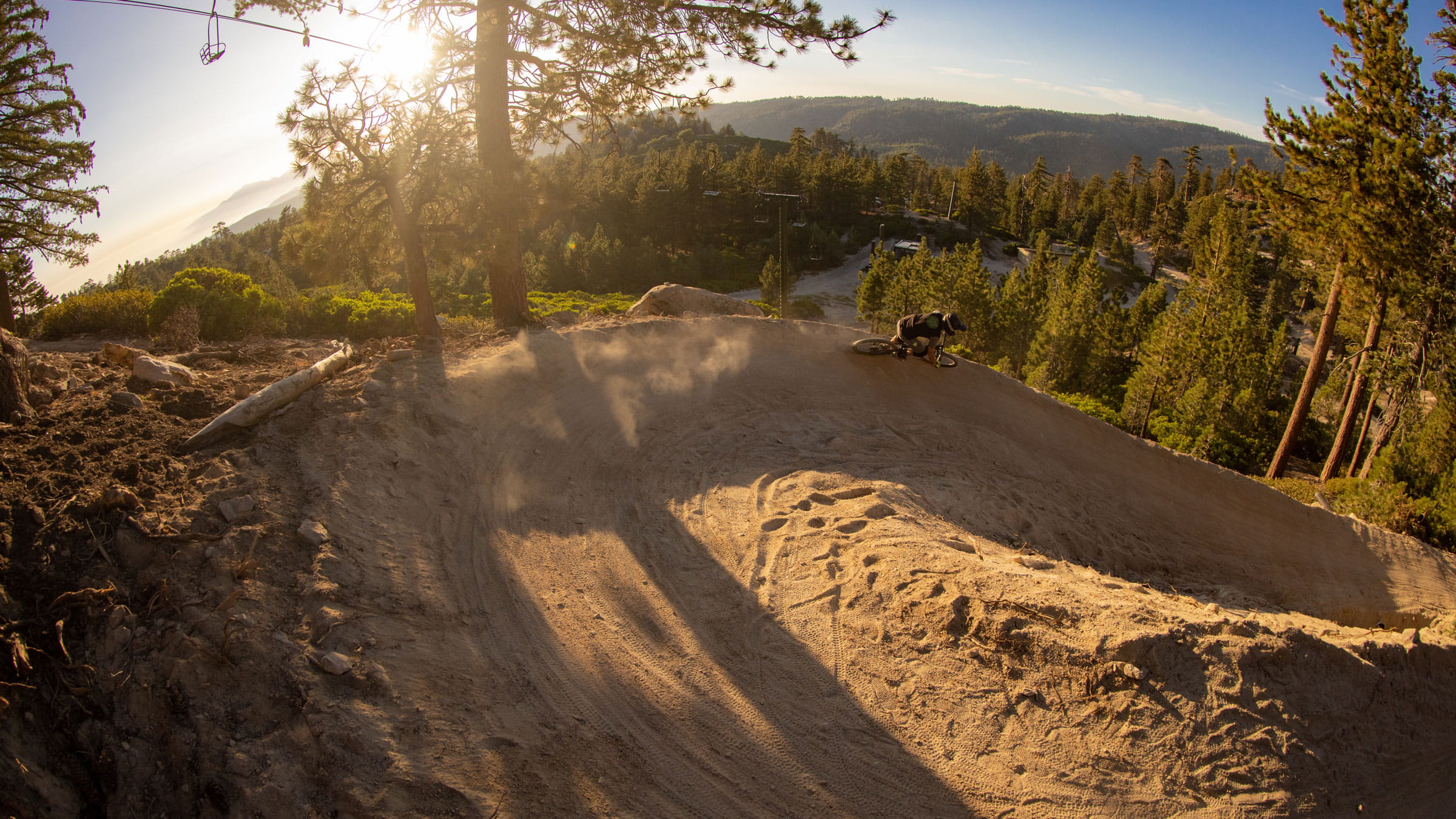 mountain biker on a sharp turn in the dirt on a trail