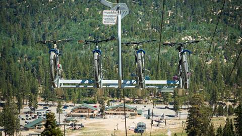 Snow Valley chairlift shot with four mountain bikes