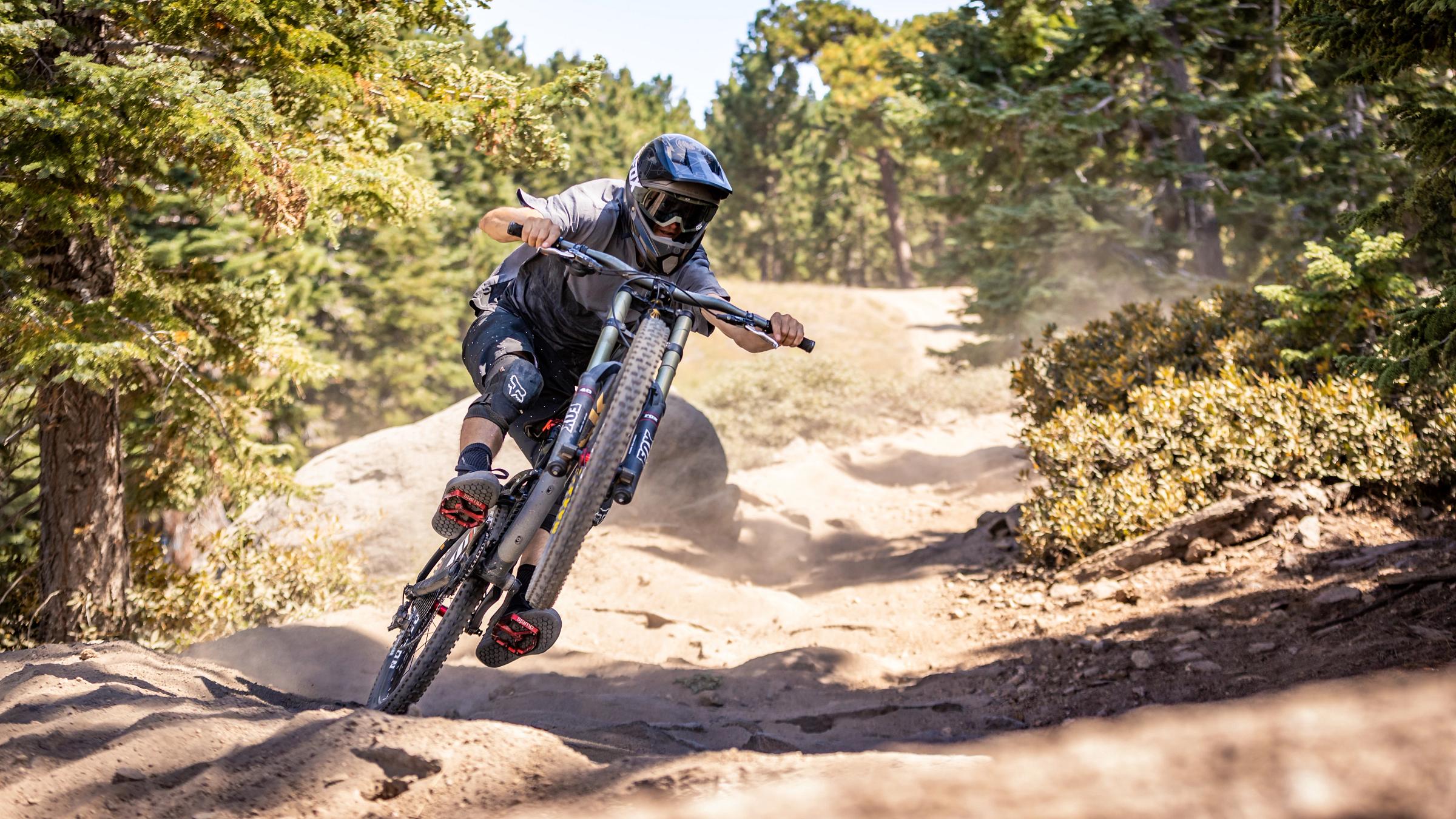 Mountain Biker going fast on a downhill trail