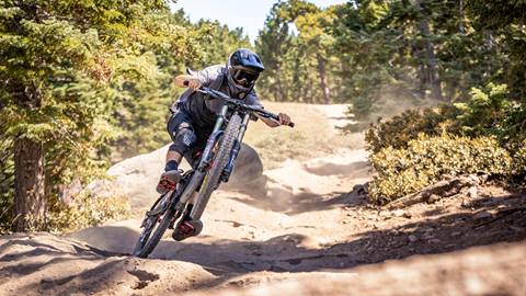Mountain Biker going fast on a downhill trail