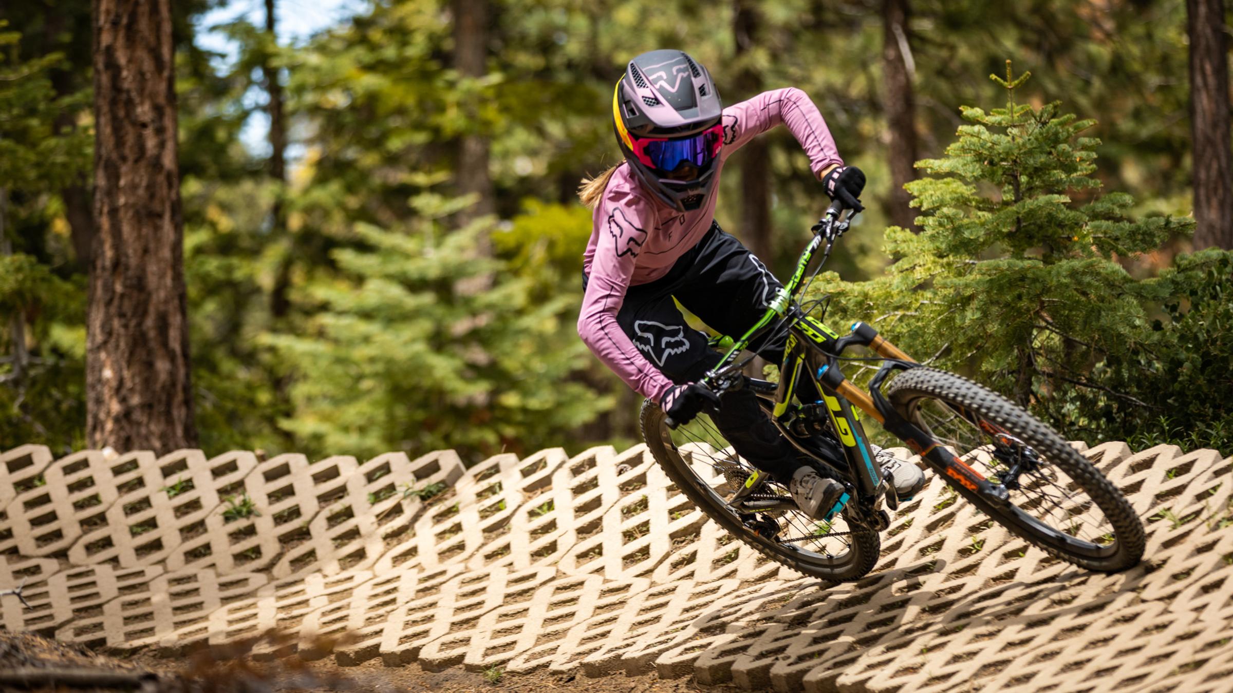 female mountain biker on a ramp