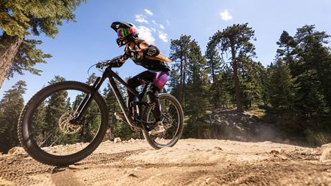 Mountain biker going on a downhill trail