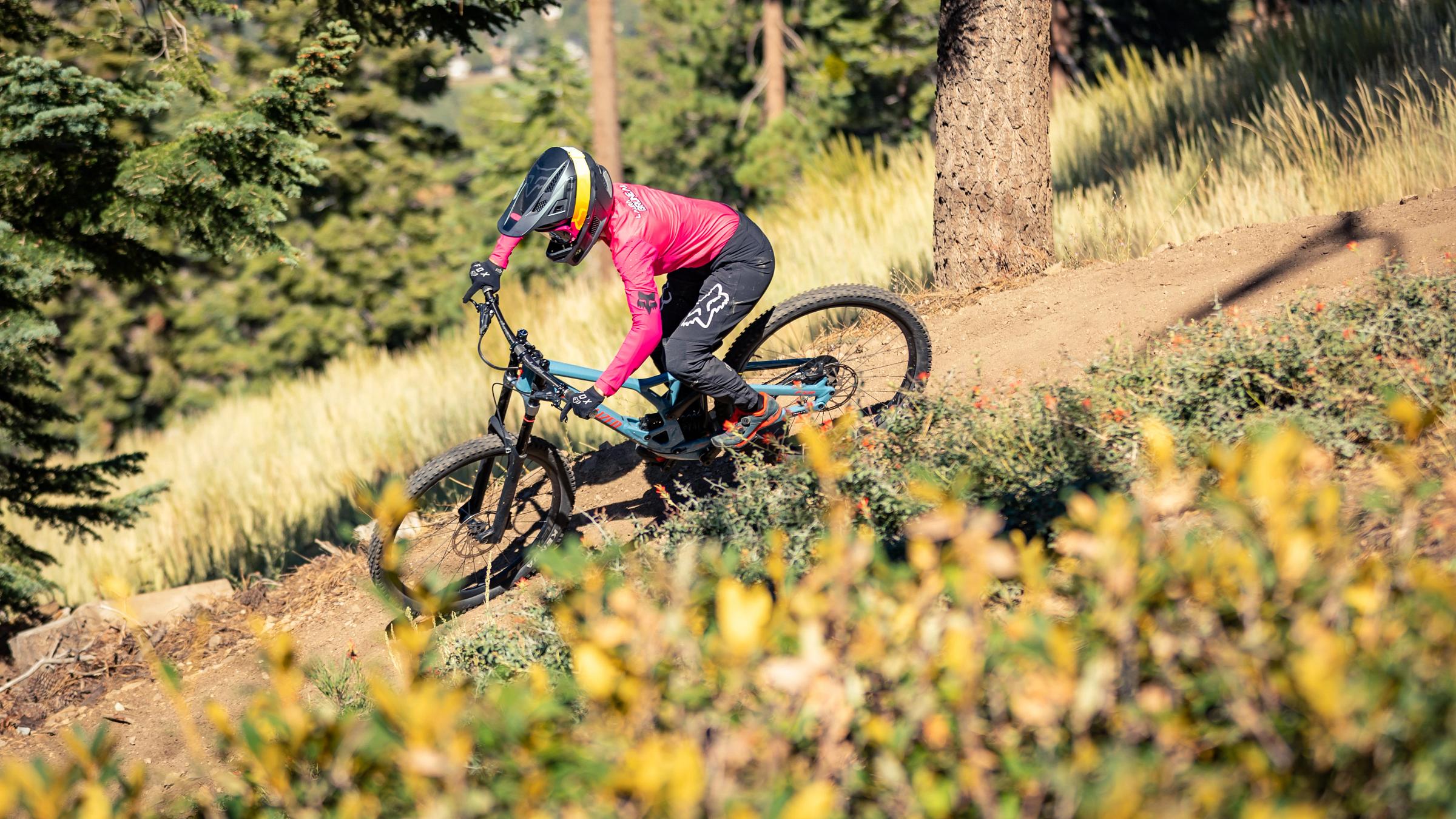 Female mountain biker on difficult trail.