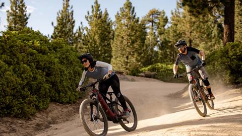 two mountain bikers going downhill