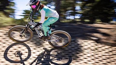 Female mountain biker on a ramp