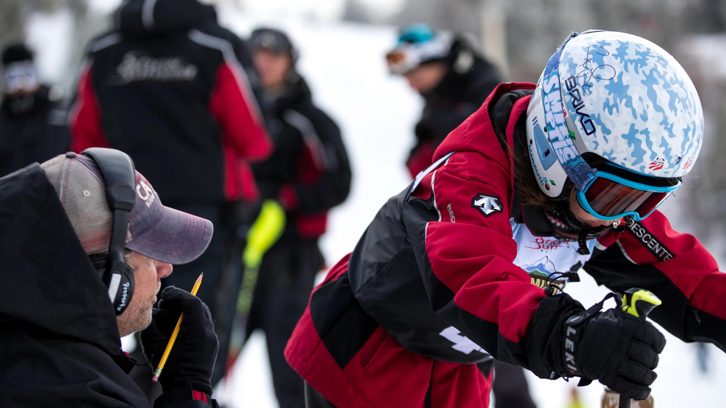 Skier racer getting ready to go downhill