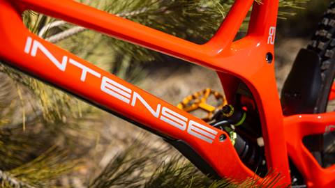 Close up shot of red bike with the Intense branding on the side of the frame
