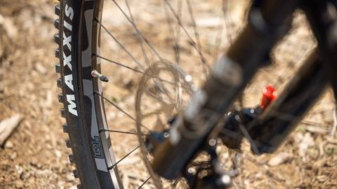 bike rentals - freeride mountain bike close up of bike wheels in the dirt at snow summit bike park