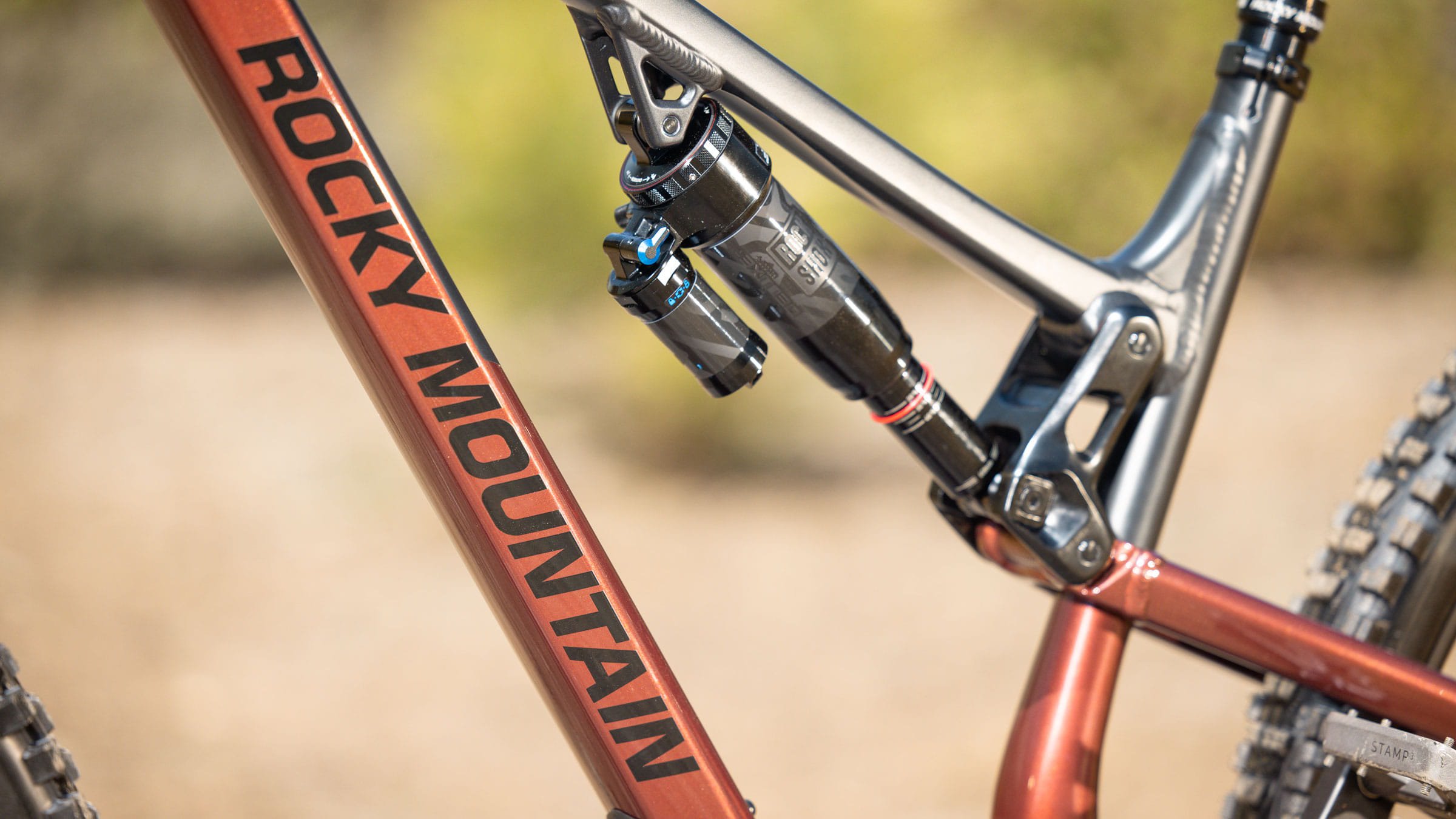 Close up of orange bike frame with Rocky Mountain written on the side