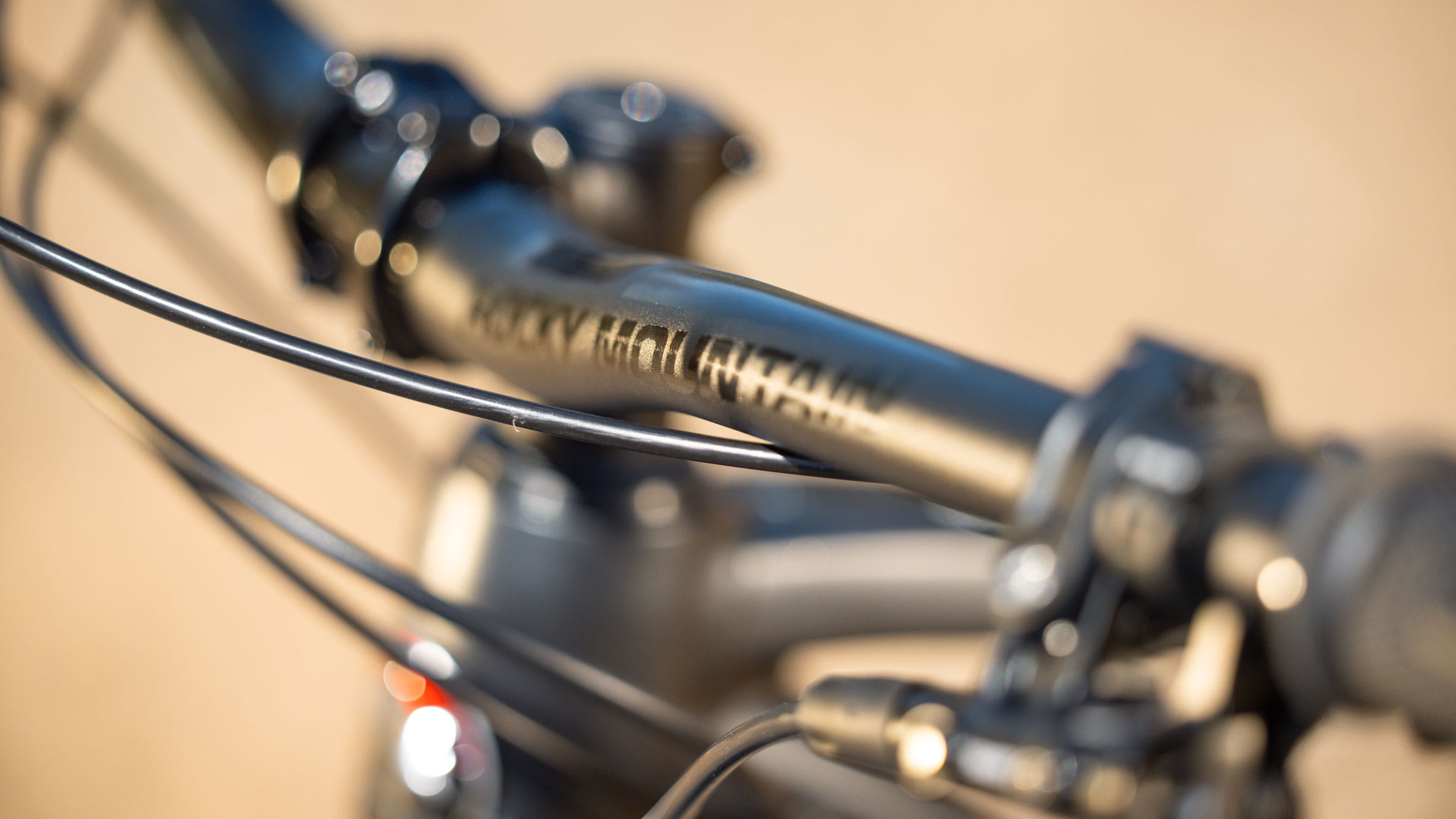 Close up shot of handle bars for a mountain bike with rocky mountain written across it