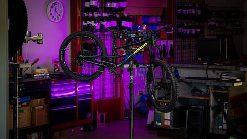 Norco Fluid Freeride mountain bike for youth hanging on a rack