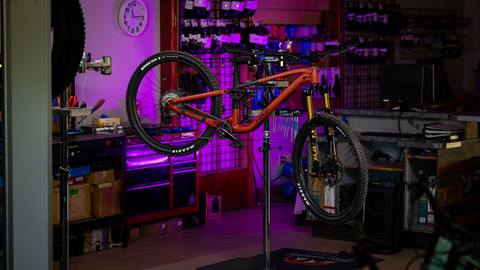 Trek Fuel mountain bike hanging on a rack