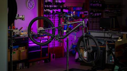Trek Slash mountain bike hanging on a rack