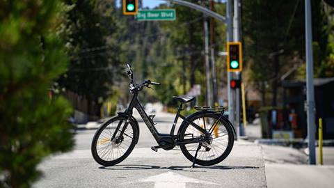 Trek eBike rental with bike stand down on the street in front of a stop light on Big Bear Blvd. in The Village in Big Bear Lake, California.