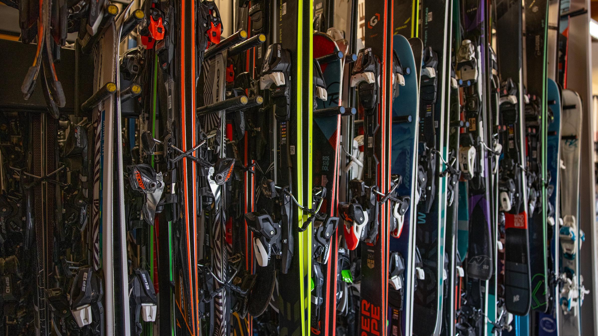 Skis hanging on racks.