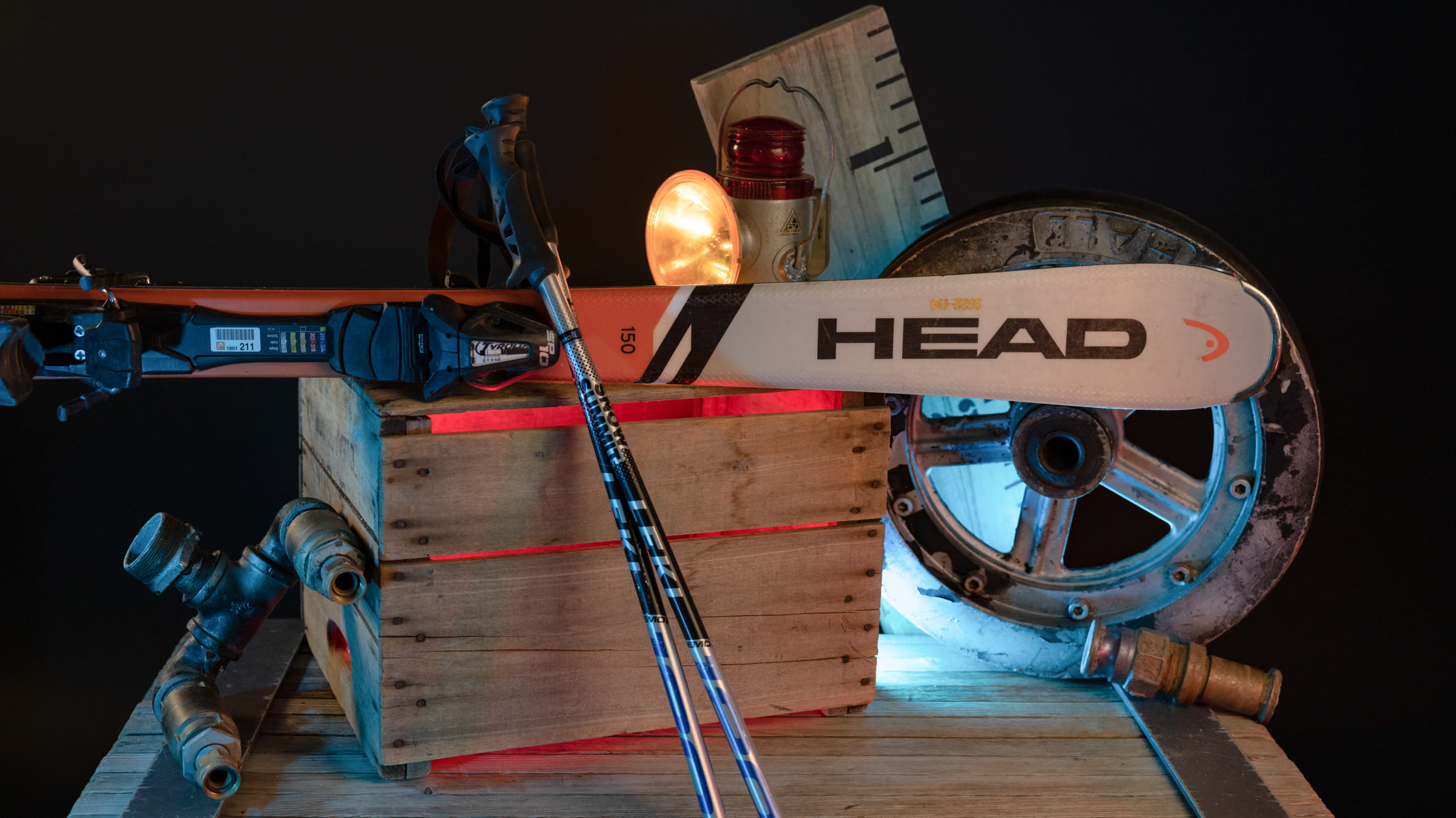 Ski poles and skis displayed upon a wooden box