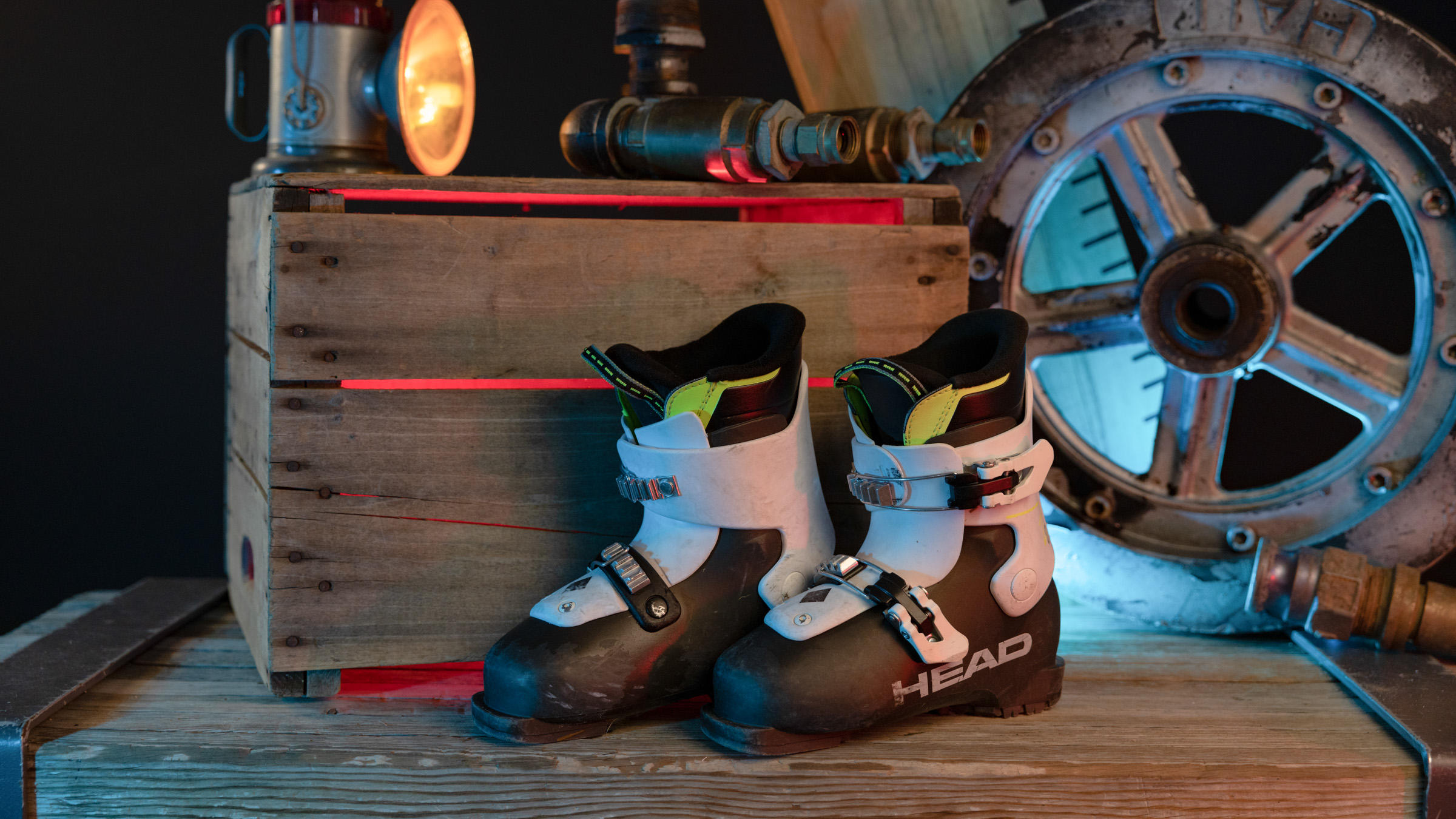 Ski boots leaning against a wooden box